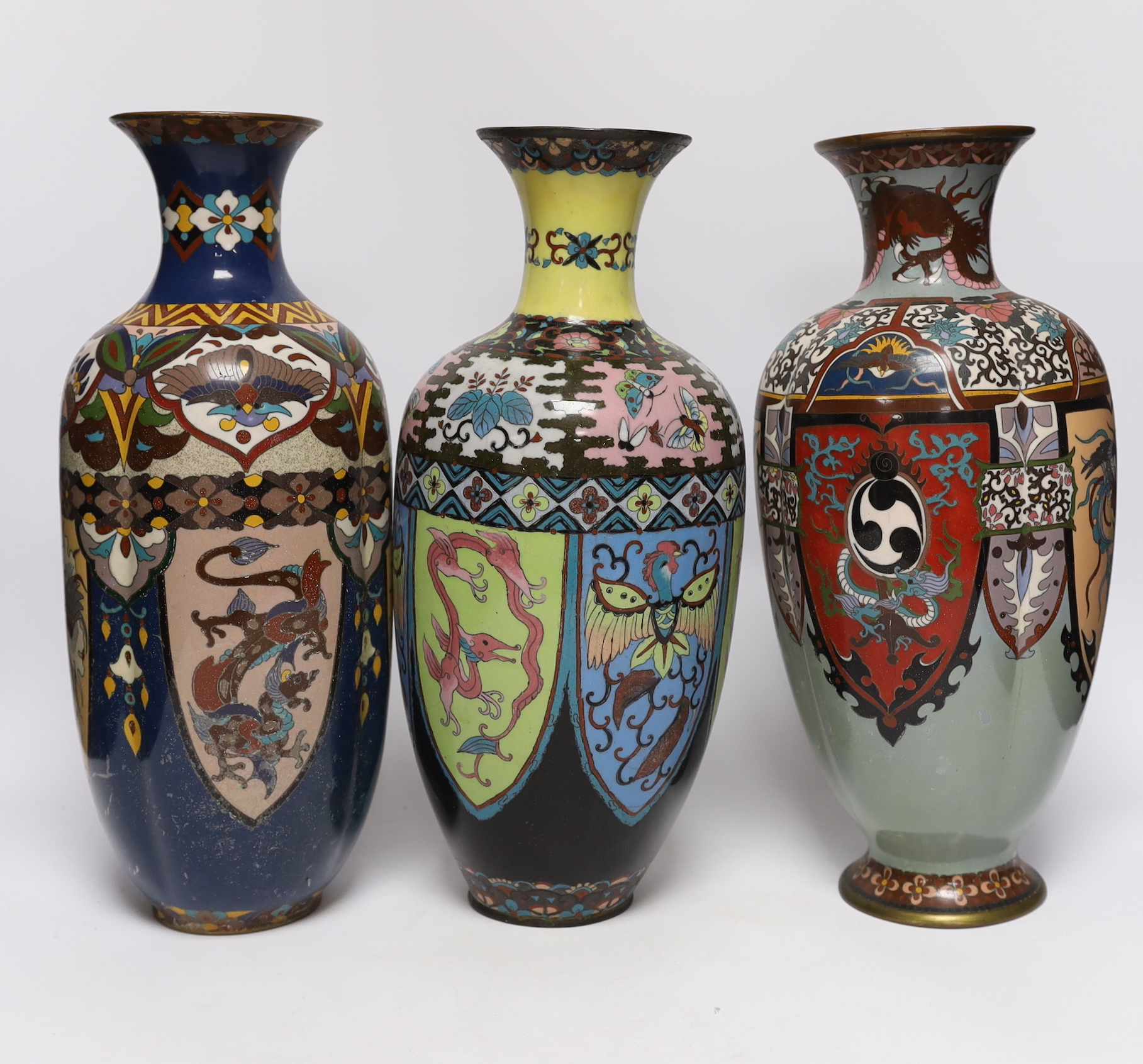 A pair of large Japanese cloisonné enamel vases, together with three similar vases, early 20th century, tallest 36.5cm high (5)